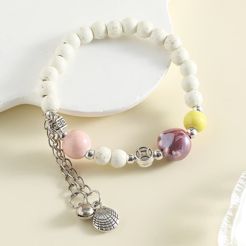 White Ceramic Beaded Bracelet with Metal Charm – Elegant Statement Bracelet